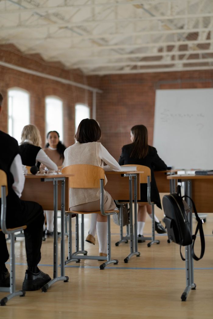 Home Students studying in a high school classroom. Diverse group focused on learning.